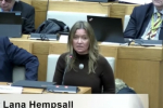 Lana Hempsall sitting in Norfolk County Council meeting speaking in favour of the Level 3 Devolution Deal